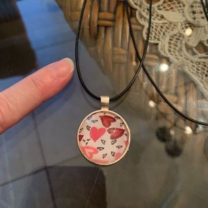 My heart is all aflutter! Silvertone pendant with vegan leather cord